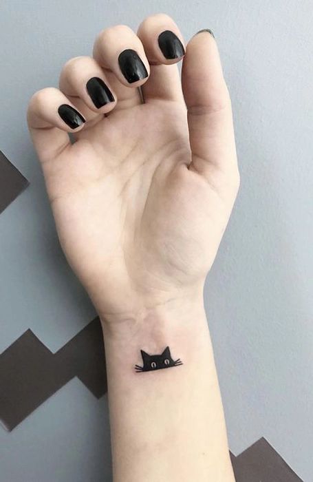 Small and discreet cat tattoo designs